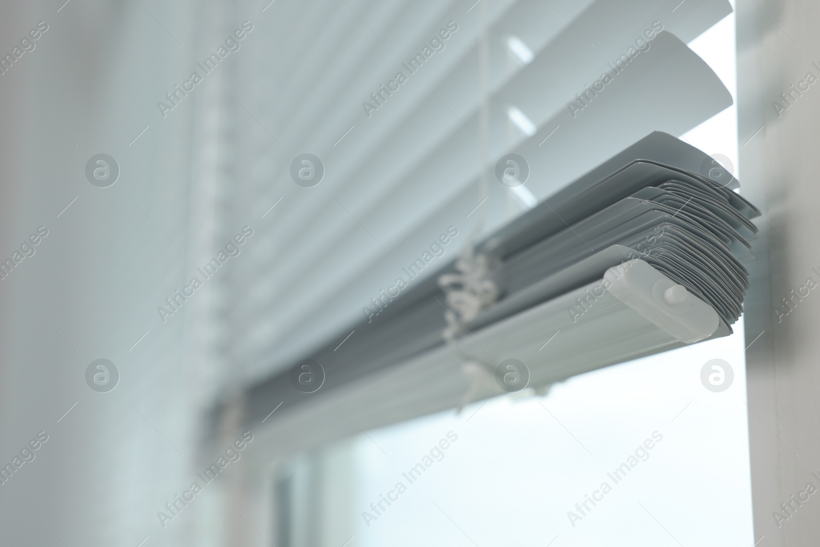 Photo of Closeup view of stylish horizontal window blinds