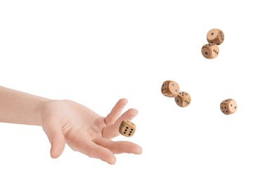 Woman throwing wooden dice on white background, closeup
