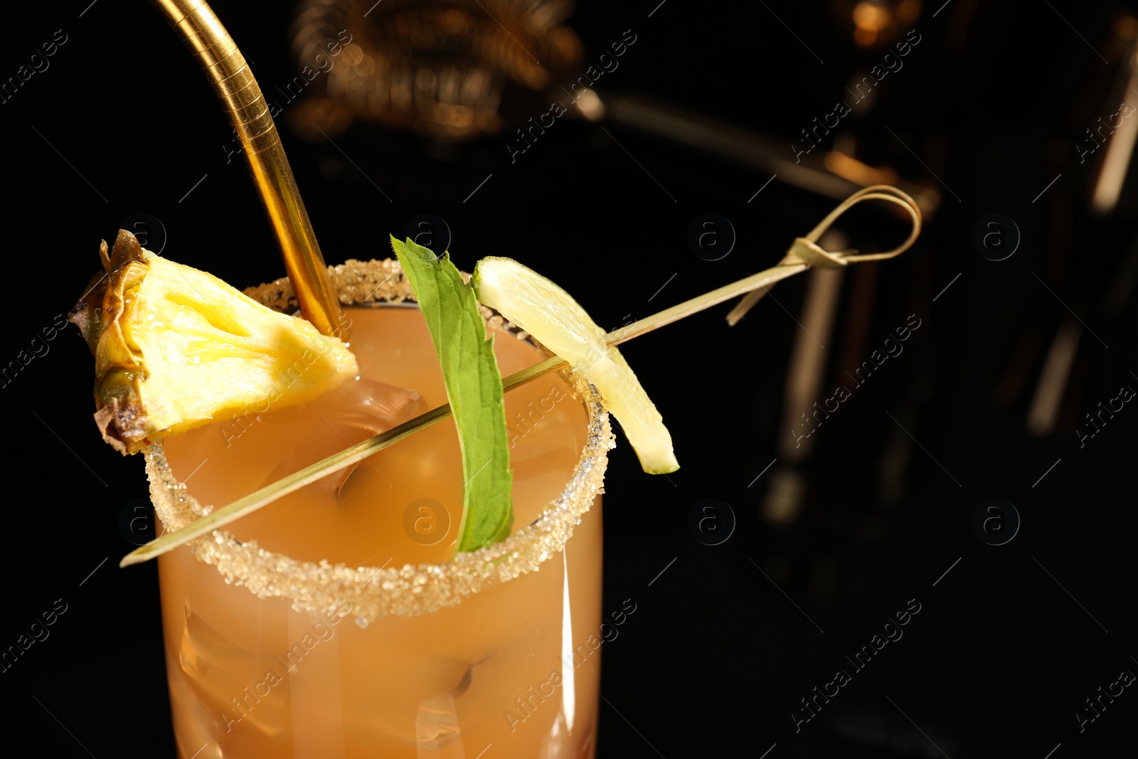 Photo of Tasty pineapple cocktail with mint and lime, closeup. Space for text