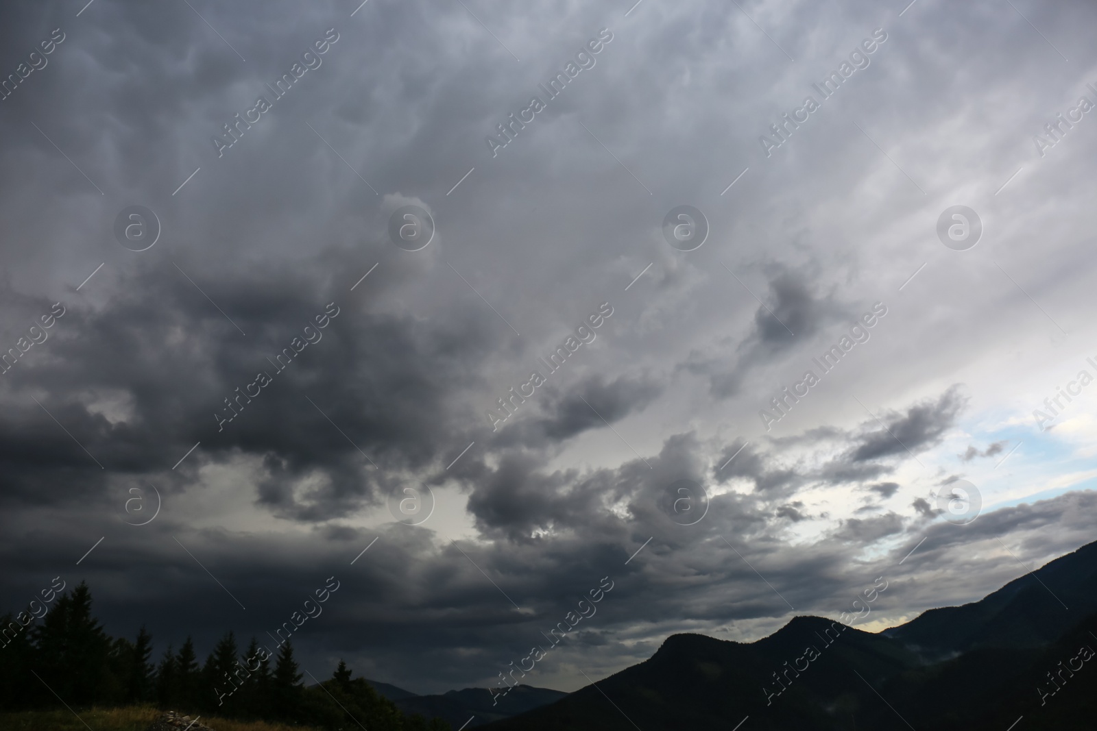 Photo of Picturesque view of cloudy sky over majestic mountain landscape