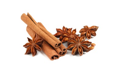 Dry anise stars and cinnamon sticks on white background