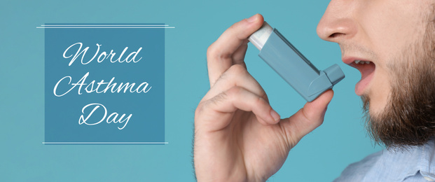 World asthma day. Young man using inhaler on blue background, banner design