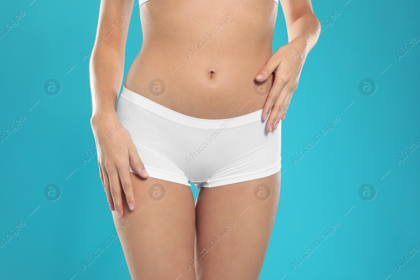 Photo of Slim young woman with smooth gentle skin on color background, closeup. Beauty and body care concept