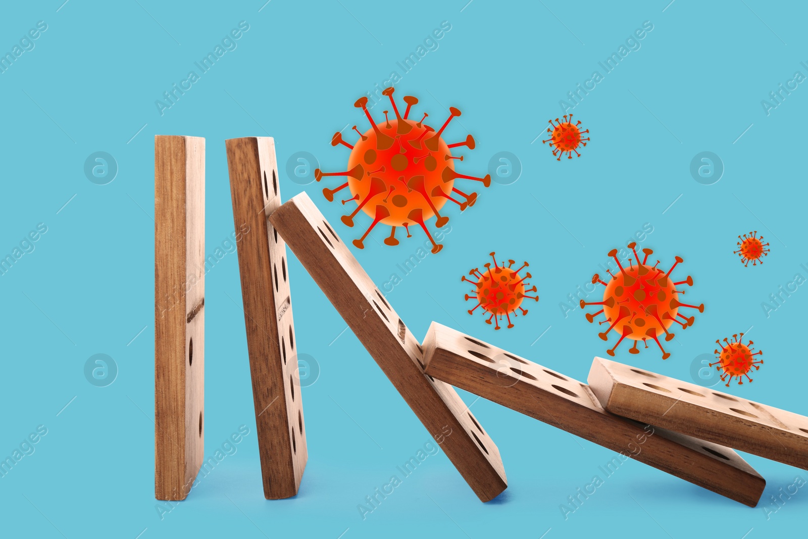 Image of Concept of spreading coronavirus. Wooden domino tiles falling on blue background