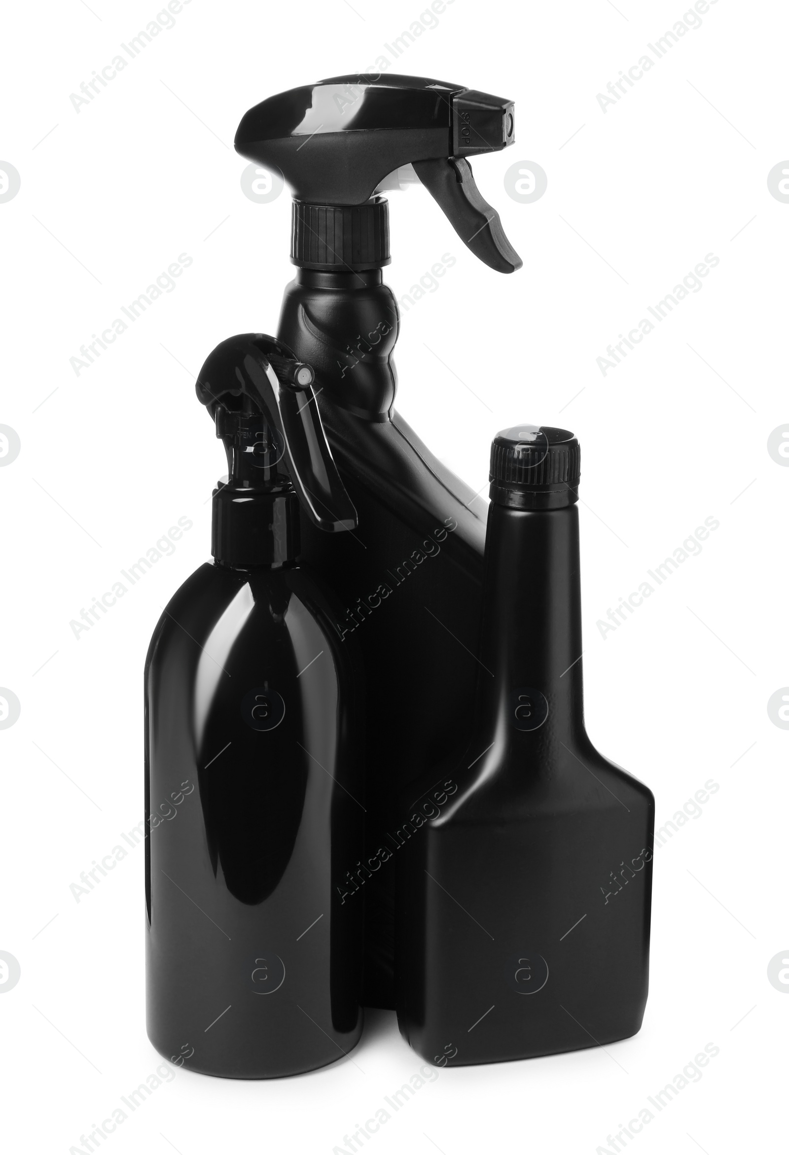 Photo of Black plastic spray bottles on white background