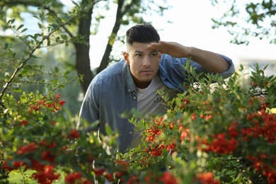 Jealous man spying on ex girlfriend in park