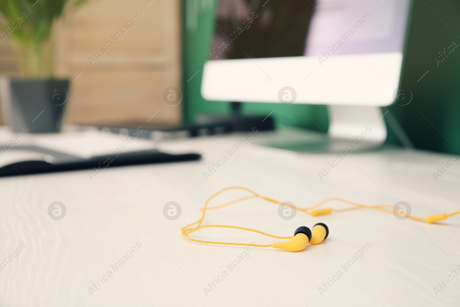 Photo of Stylish headphones on office table. Space for text