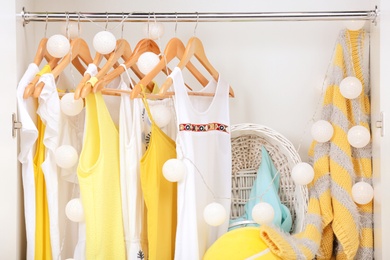 Photo of Women clothing on hangers in wardrobe