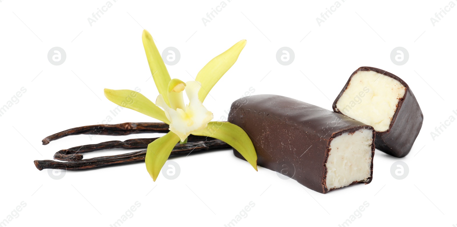 Photo of Glazed curd cheese bars, vanilla pods and flower isolated on white