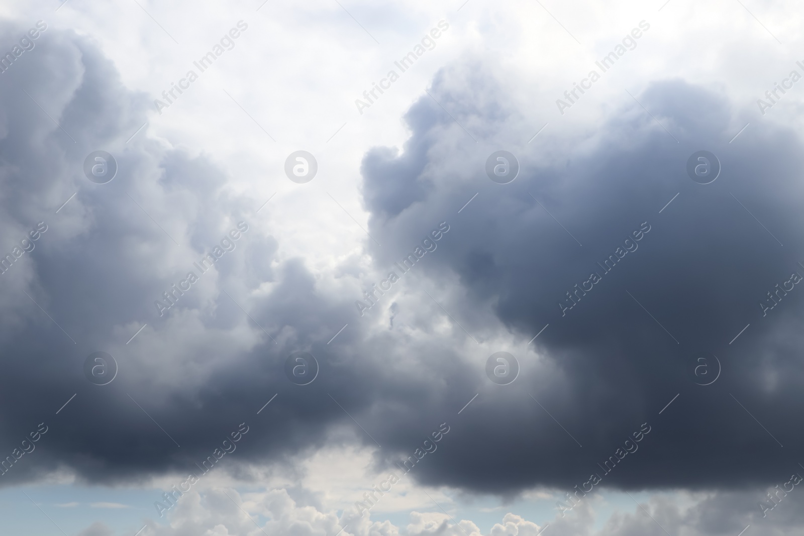 Photo of Sky with heavy rainy clouds on grey day