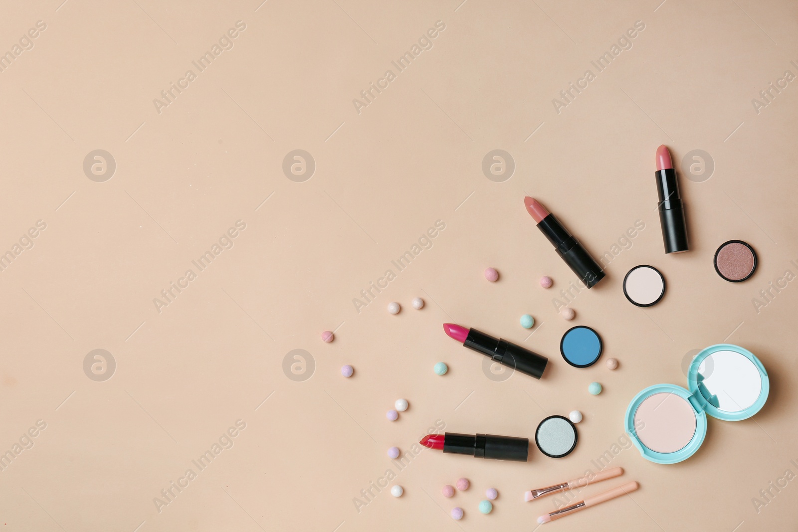 Photo of Decorative makeup products on color background