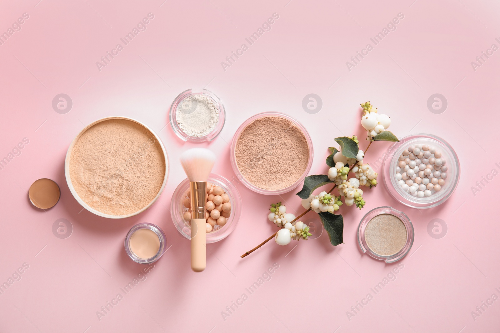 Photo of Flat lay composition with various makeup face powders on color background