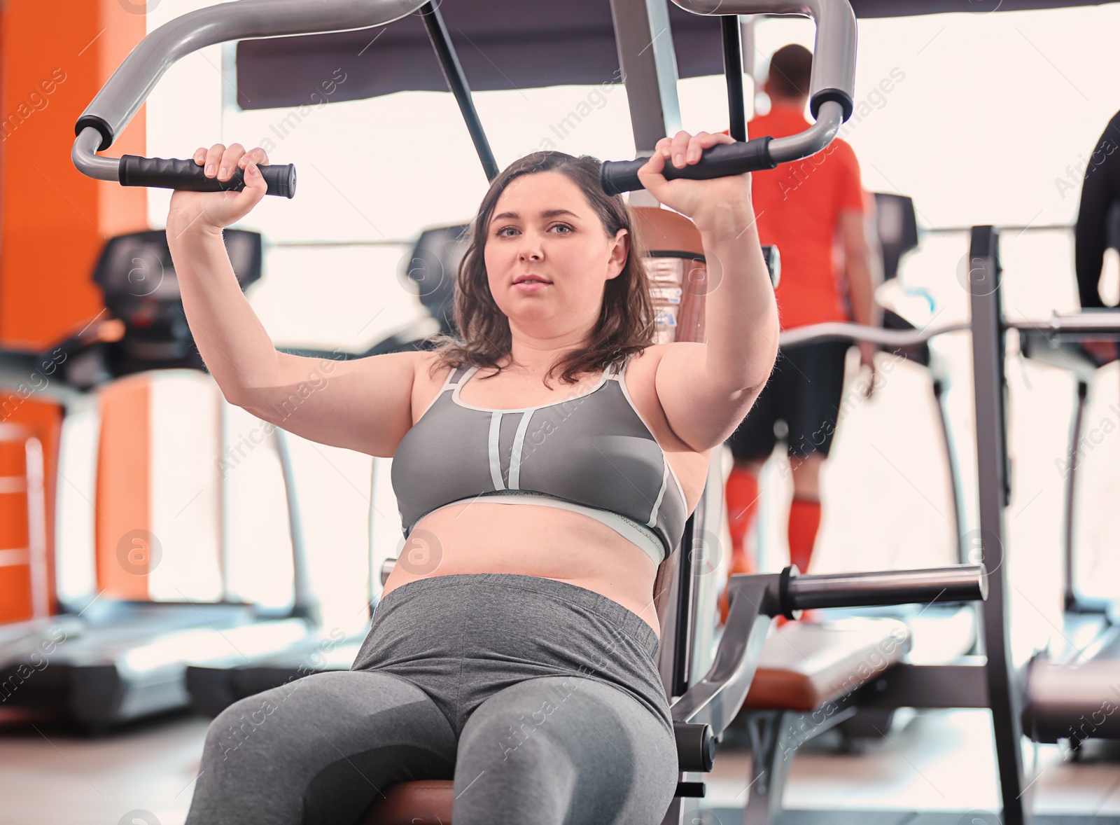 Photo of Overweight woman training in gym