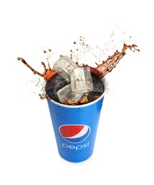 MYKOLAIV, UKRAINE - JUNE 9, 2021: Pepsi splashing out of paper cup isolated on white