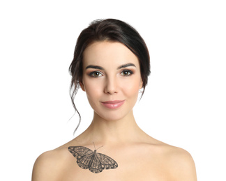 Young woman with beautiful tattoo of butterfly on her body against white background