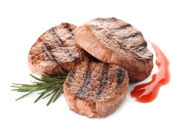 Photo of Delicious grilled meat with rosemary and sauce on white background