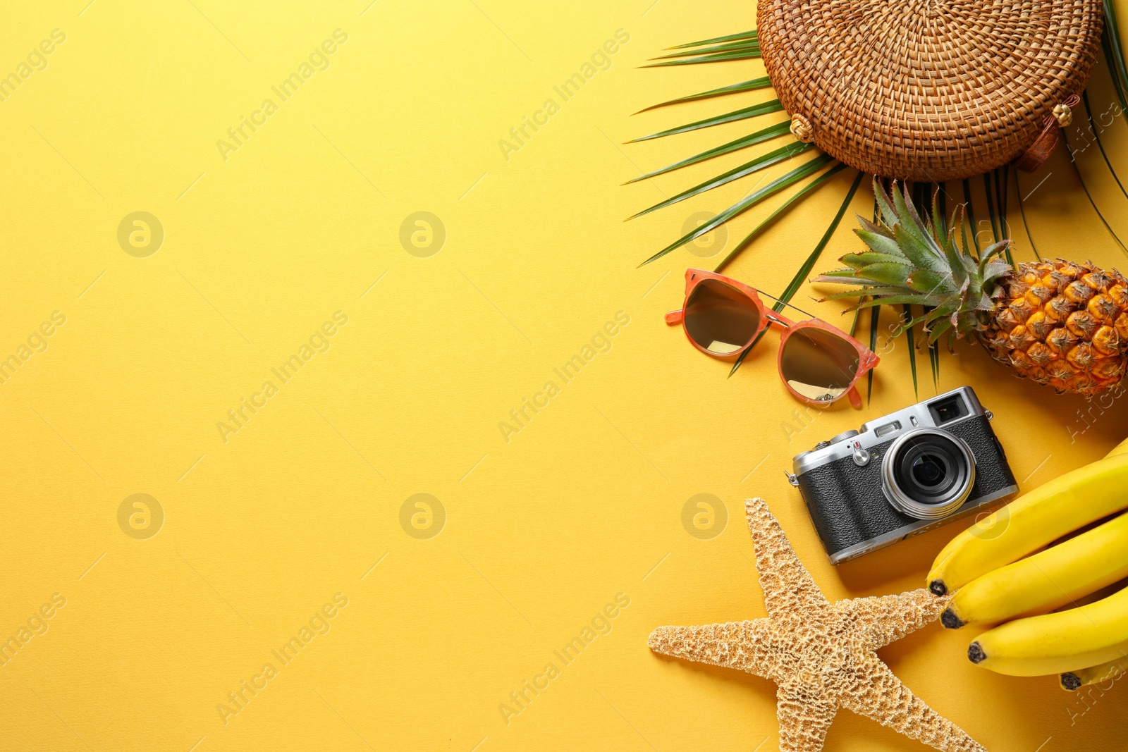 Photo of Flat lay composition with beach accessories on color background. Space for text