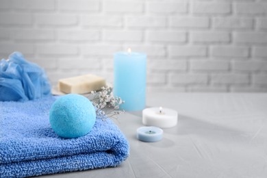 Photo of Beautiful composition with aromatic bath bomb on grey table, space for text