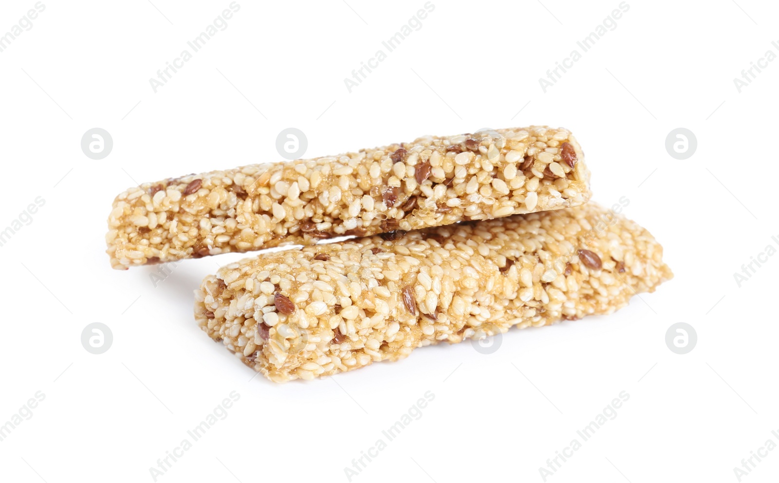 Photo of Tasty sesame seed bars isolated on white