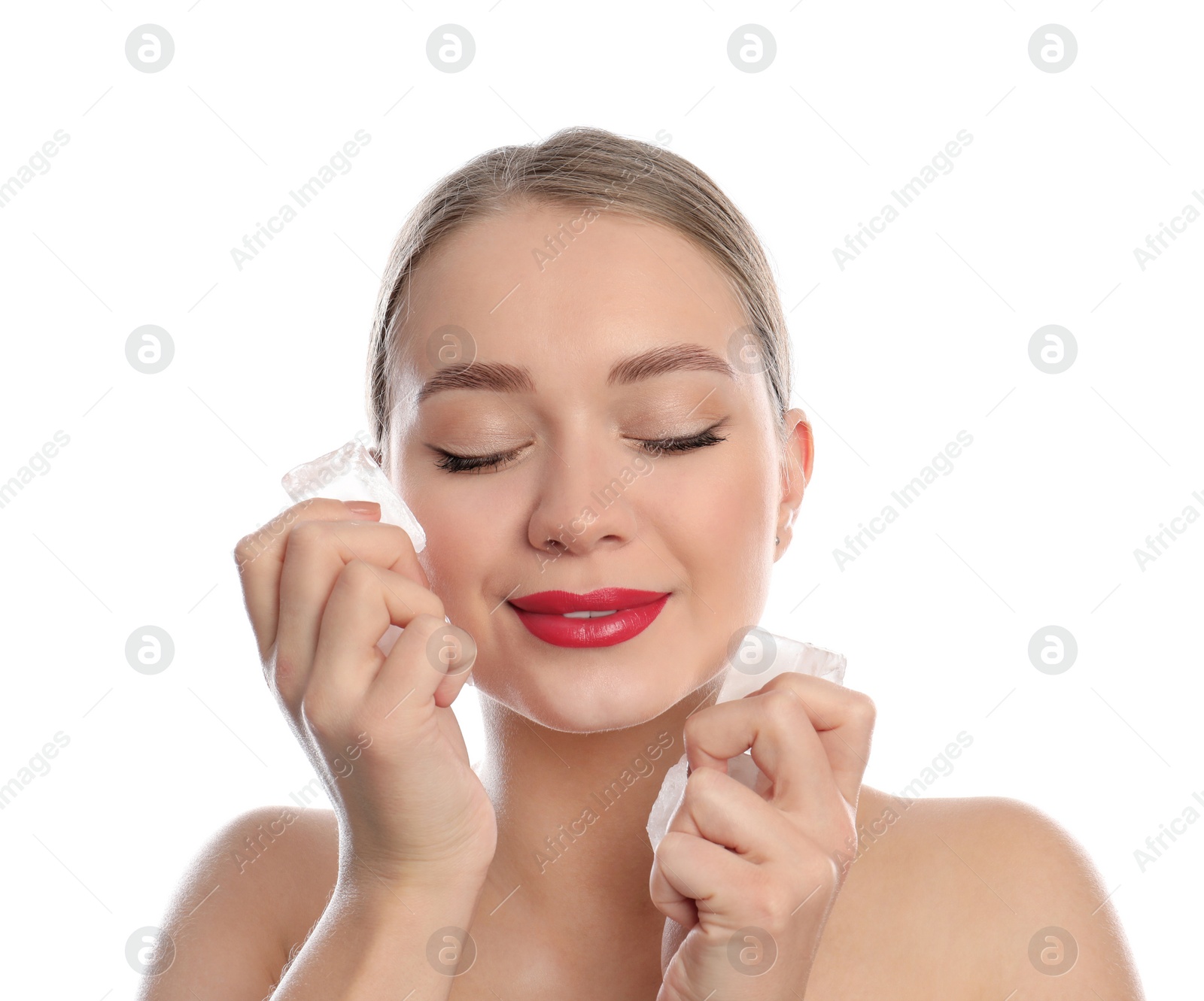 Photo of Young woman with ice cubes on white background. Skin care