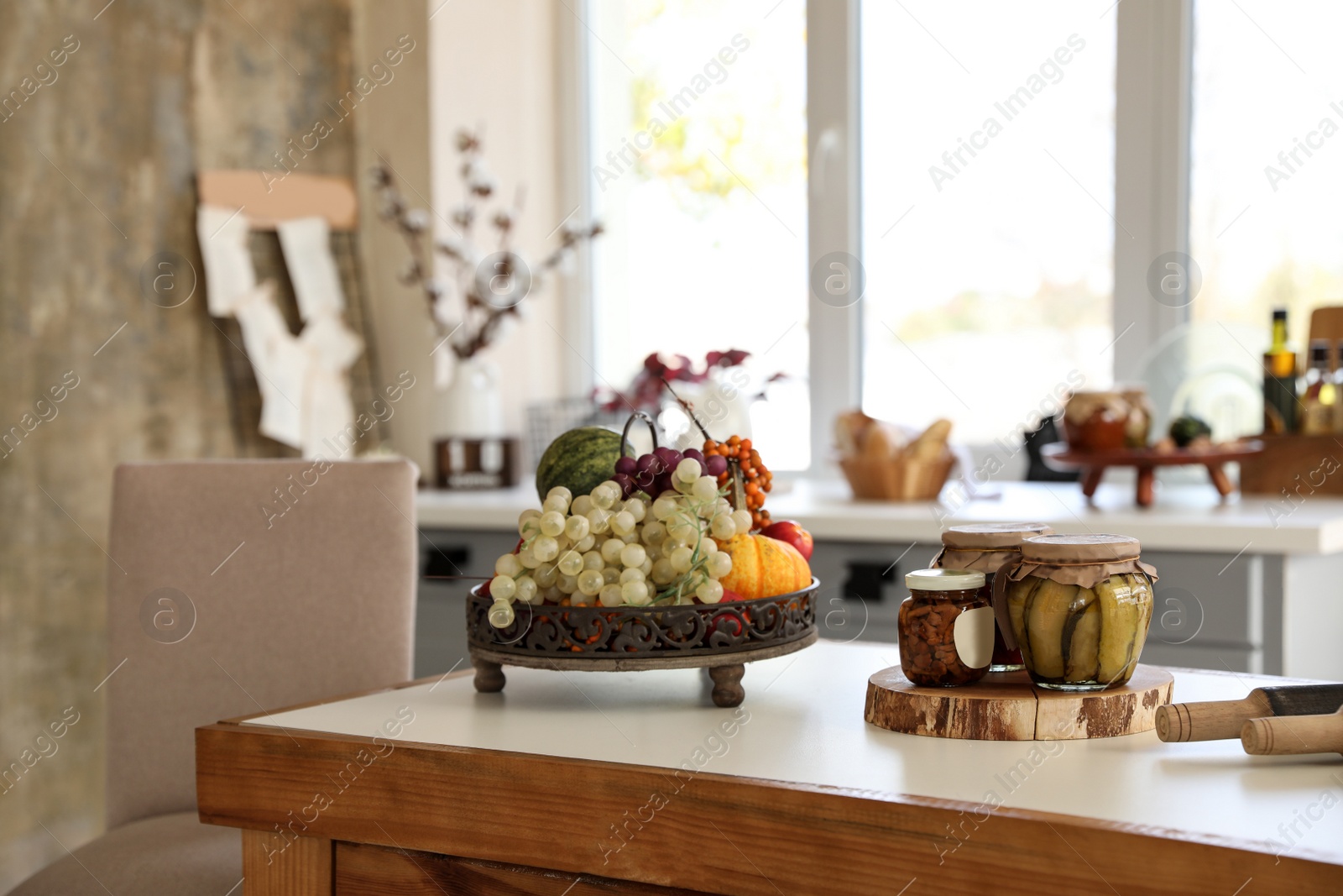 Photo of Products on dining table in modern kitchen interior