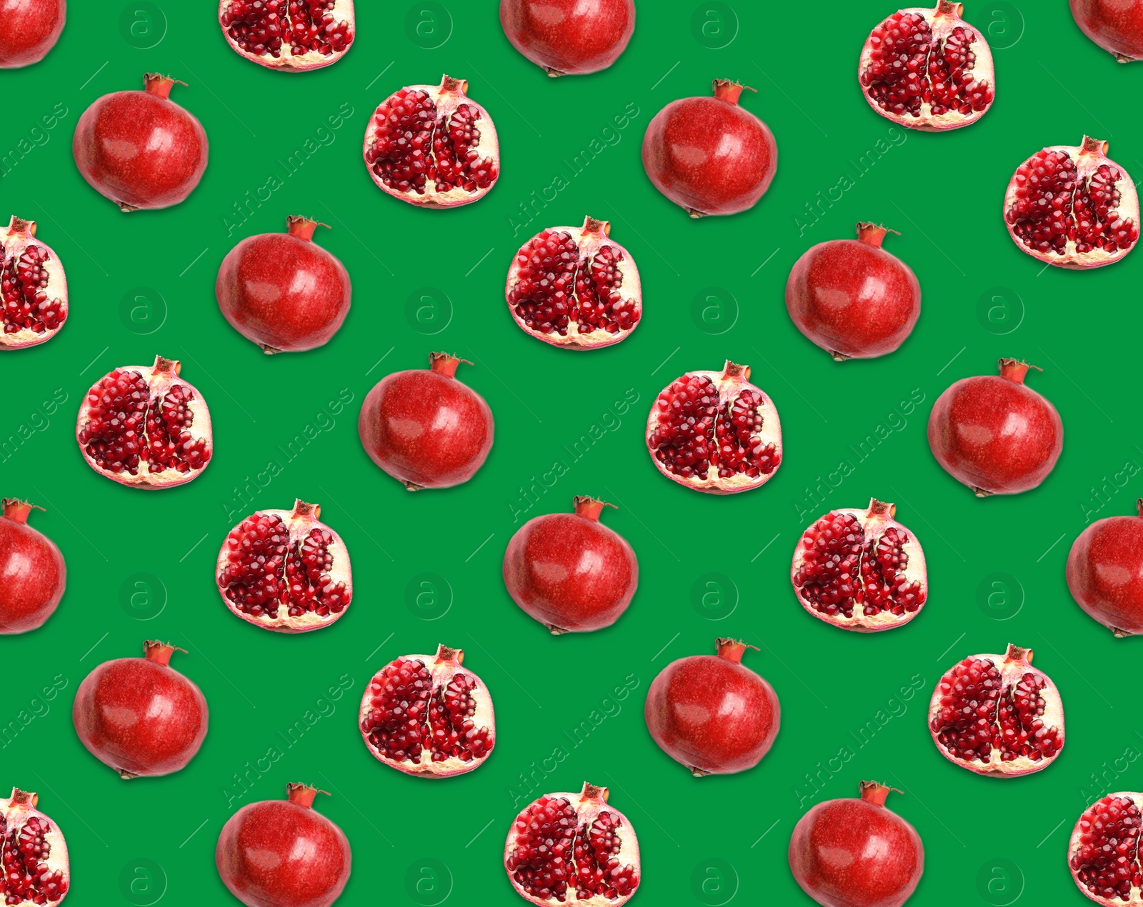 Image of Pattern of whole and halved pomegranates on green background