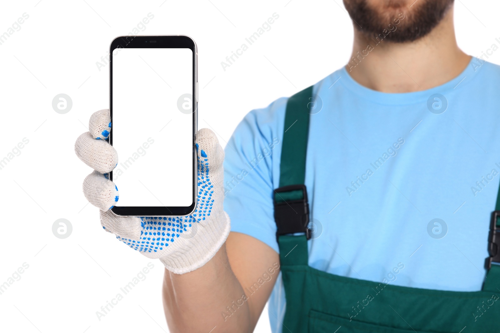 Photo of Professional repairman in uniform showing smartphone on white background, closeup