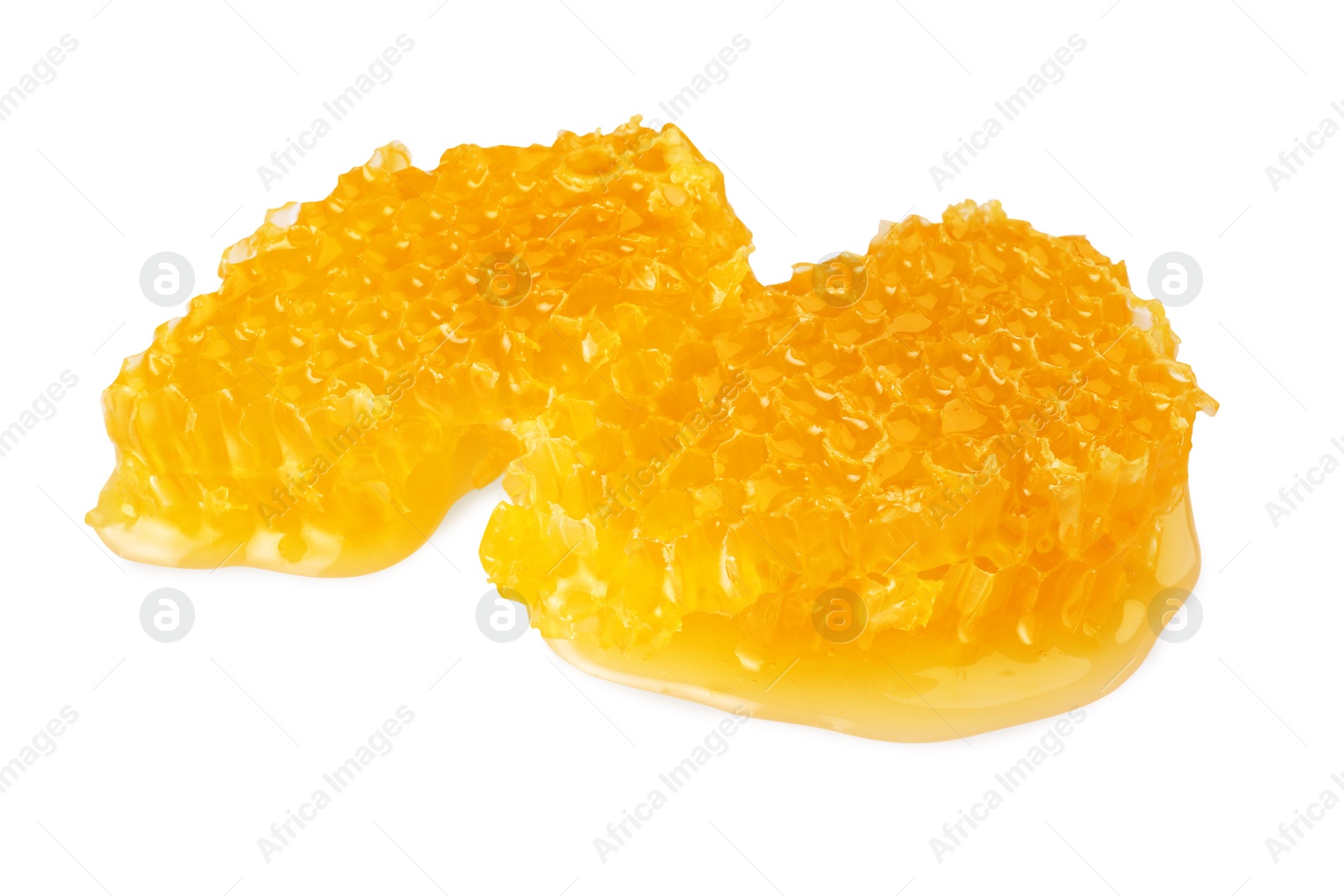 Photo of Pieces of natural honeycomb with tasty honey isolated on white