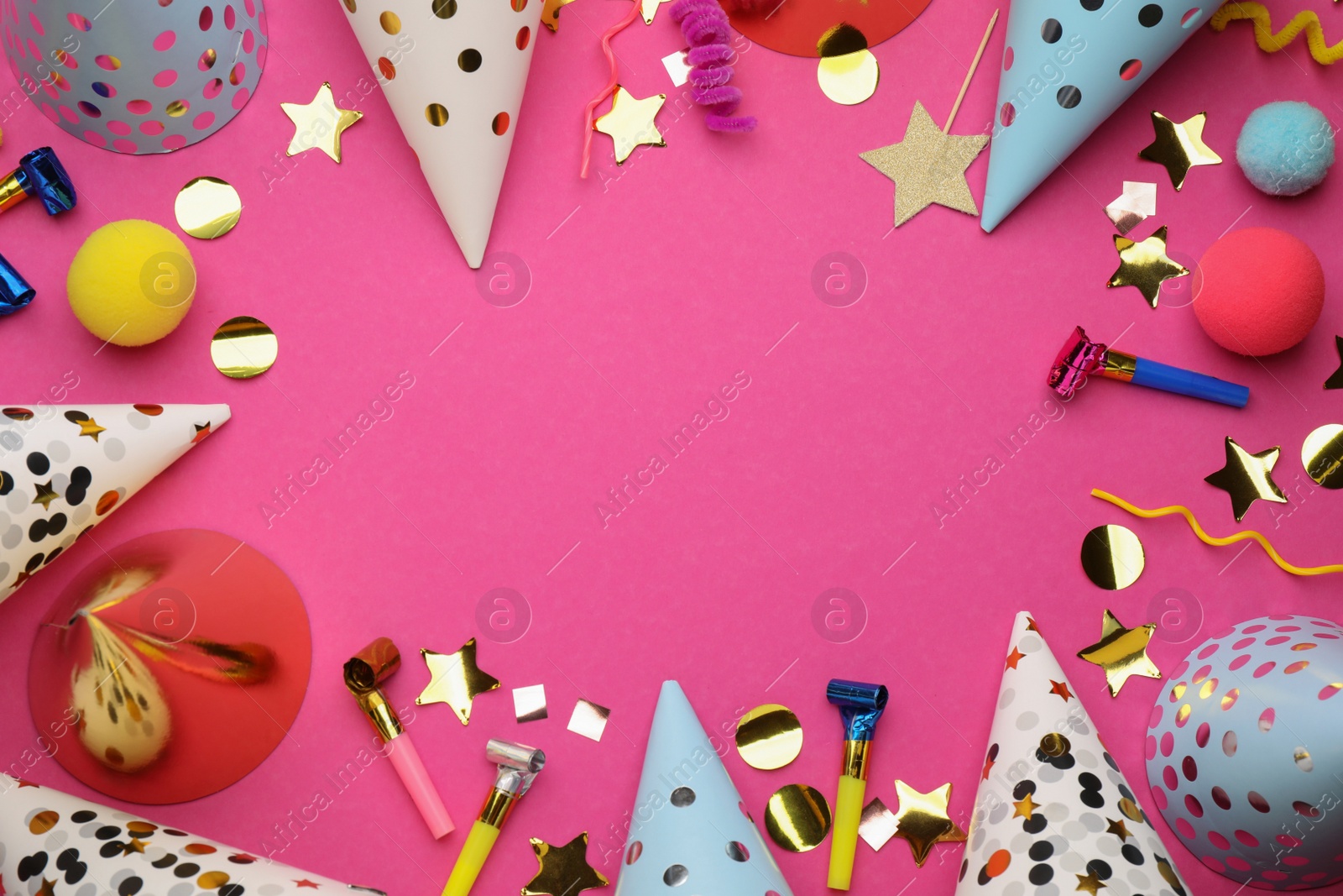 Photo of Flat lay composition with party hats and other festive items on bright pink background. Space for text