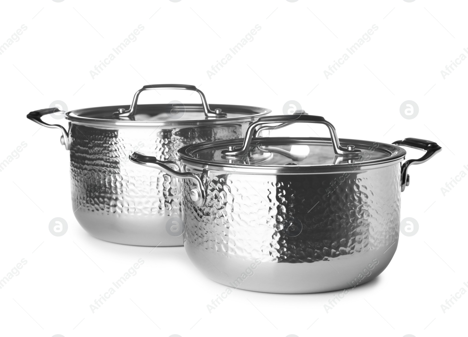 Photo of Modern metallic clean saucepans isolated on white