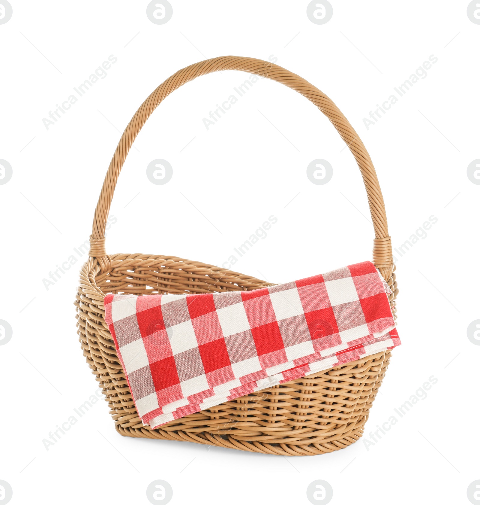 Photo of Wicker picnic basket with checkered blanket on white background