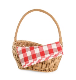 Wicker picnic basket with checkered blanket on white background