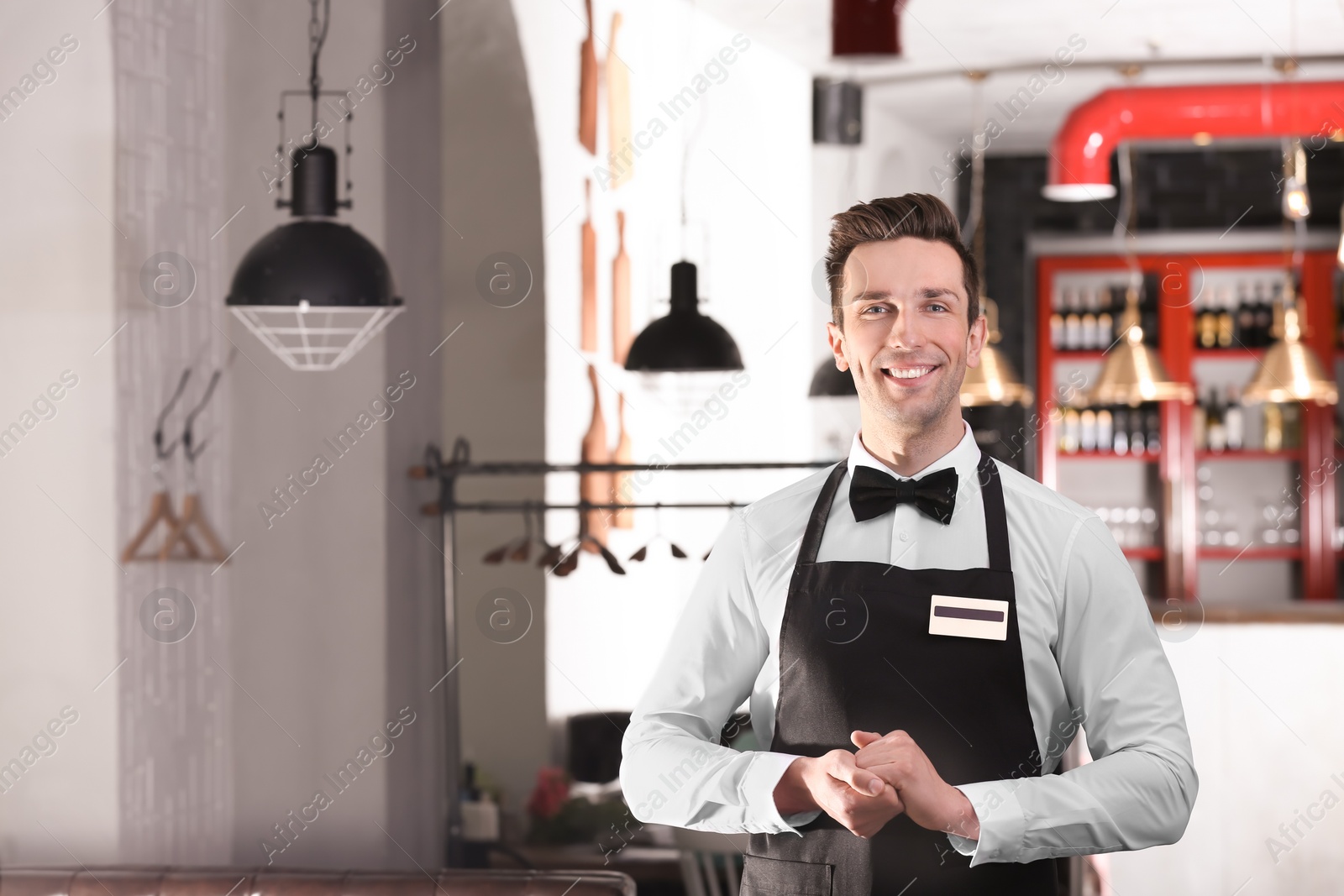 Photo of Waiter in elegant uniform at workplace