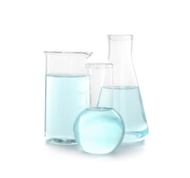 Photo of Laboratory glassware with liquid on white background. Chemical analysis