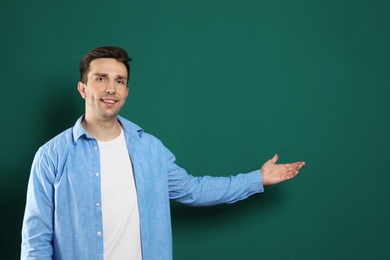 Photo of Portrait of male teacher on color background