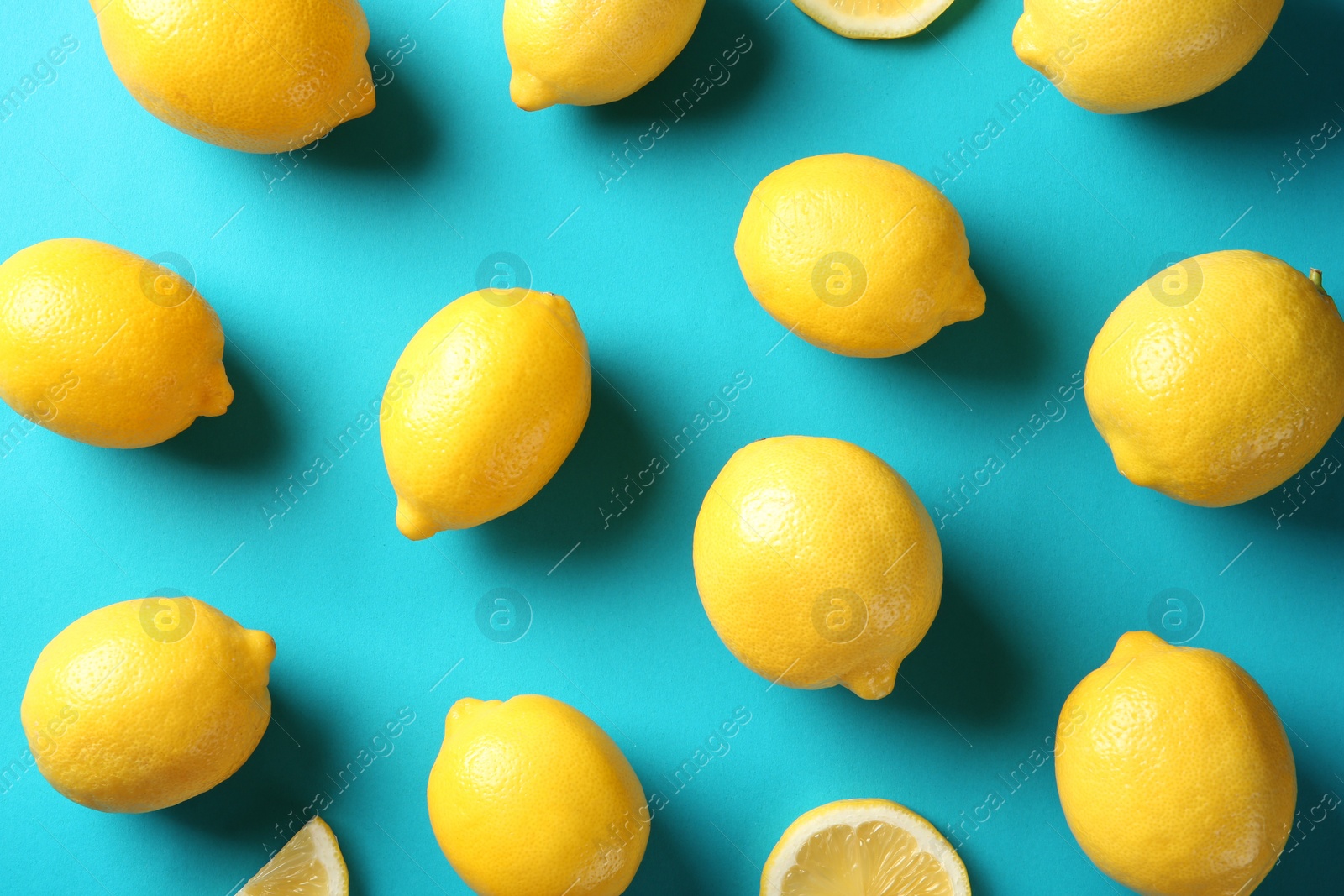 Photo of Flat lay composition with lemons on color background