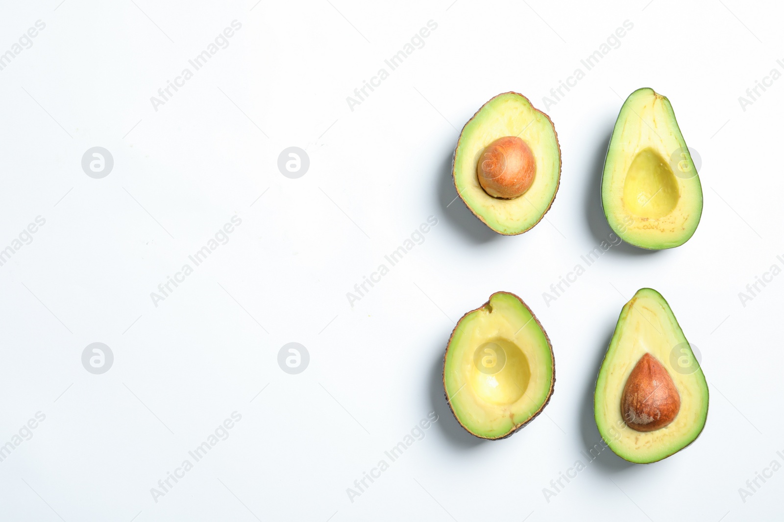 Photo of Composition with ripe fresh avocados on white background