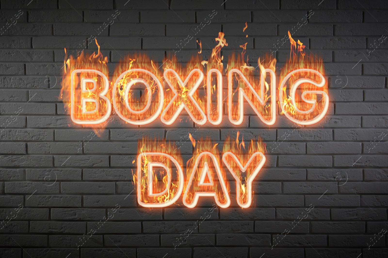 Image of Flaming text Boxing Day against brick wall