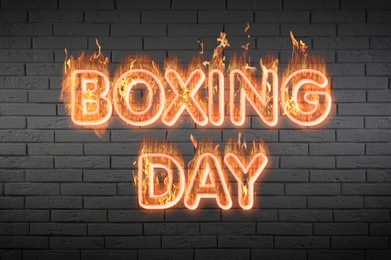 Image of Flaming text Boxing Day against brick wall