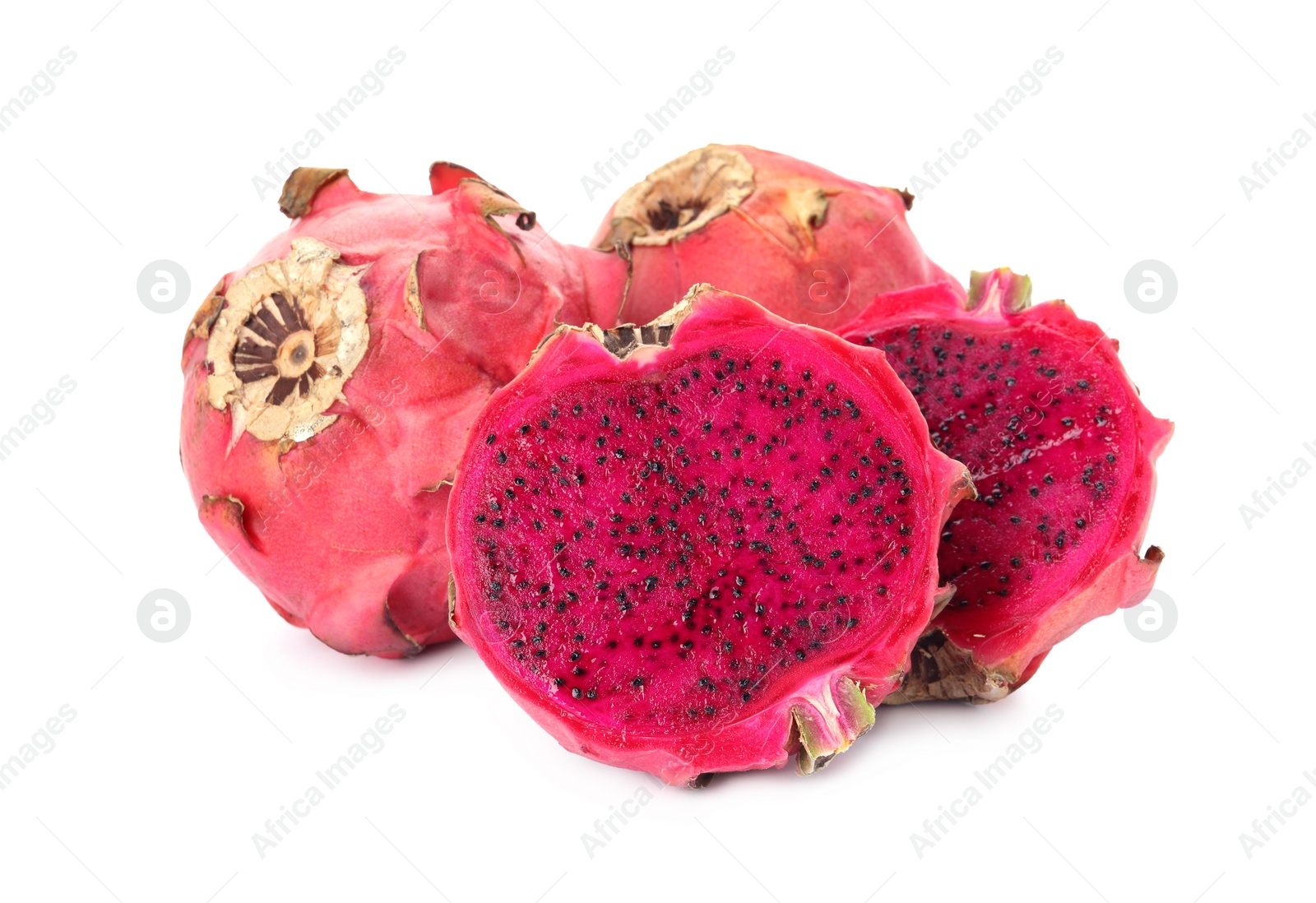 Photo of Delicious cut and whole red pitahaya fruits on white background