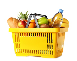 Photo of Shopping basket with grocery products on white background