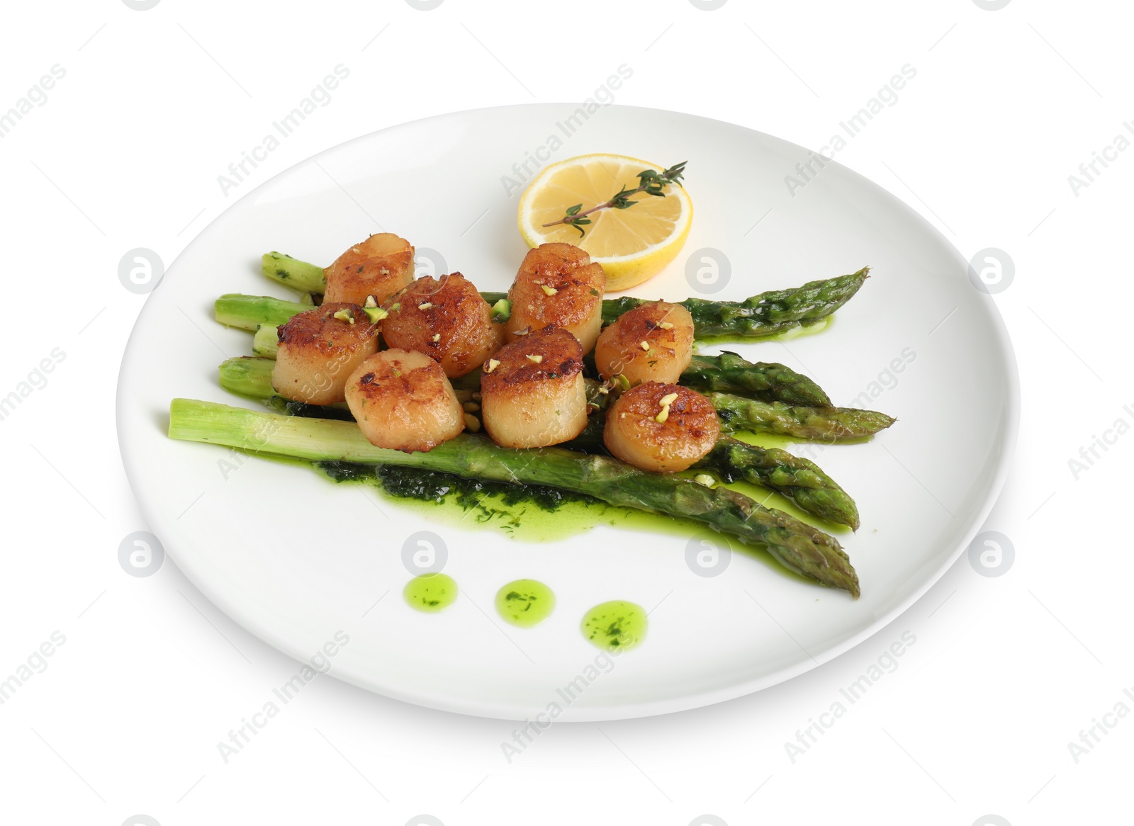 Photo of Delicious fried scallops with asparagus, lemon and thyme isolated on white