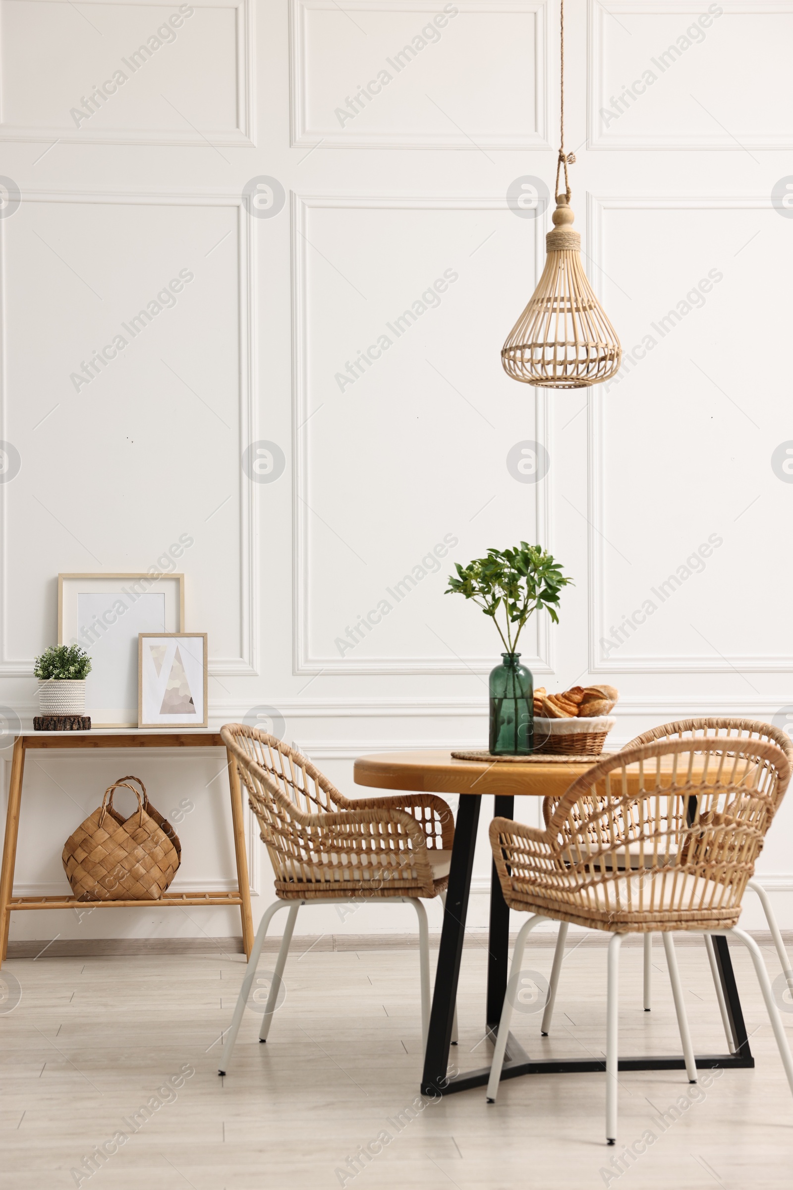 Photo of Dining room interior with comfortable furniture and plants