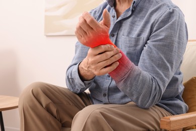 Image of Man suffering from rheumatism at home, closeup