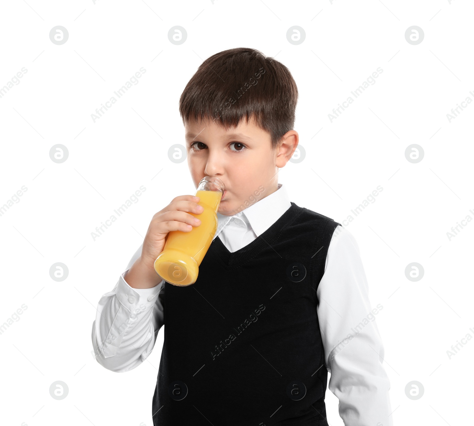Photo of Happy boy holding bottle of juice on white background