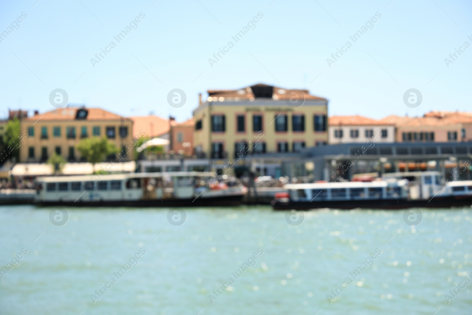 Photo of VENICE, ITALY - JUNE 13, 2019: Blurred view of city on sea shore