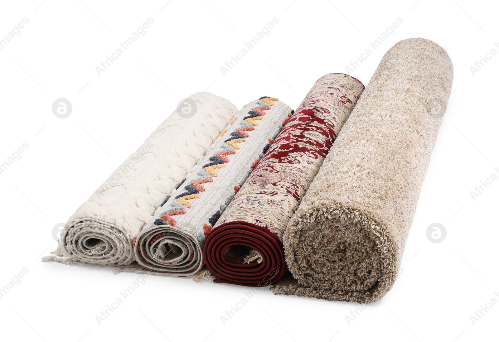 Photo of Rolled carpets on white background. Interior element