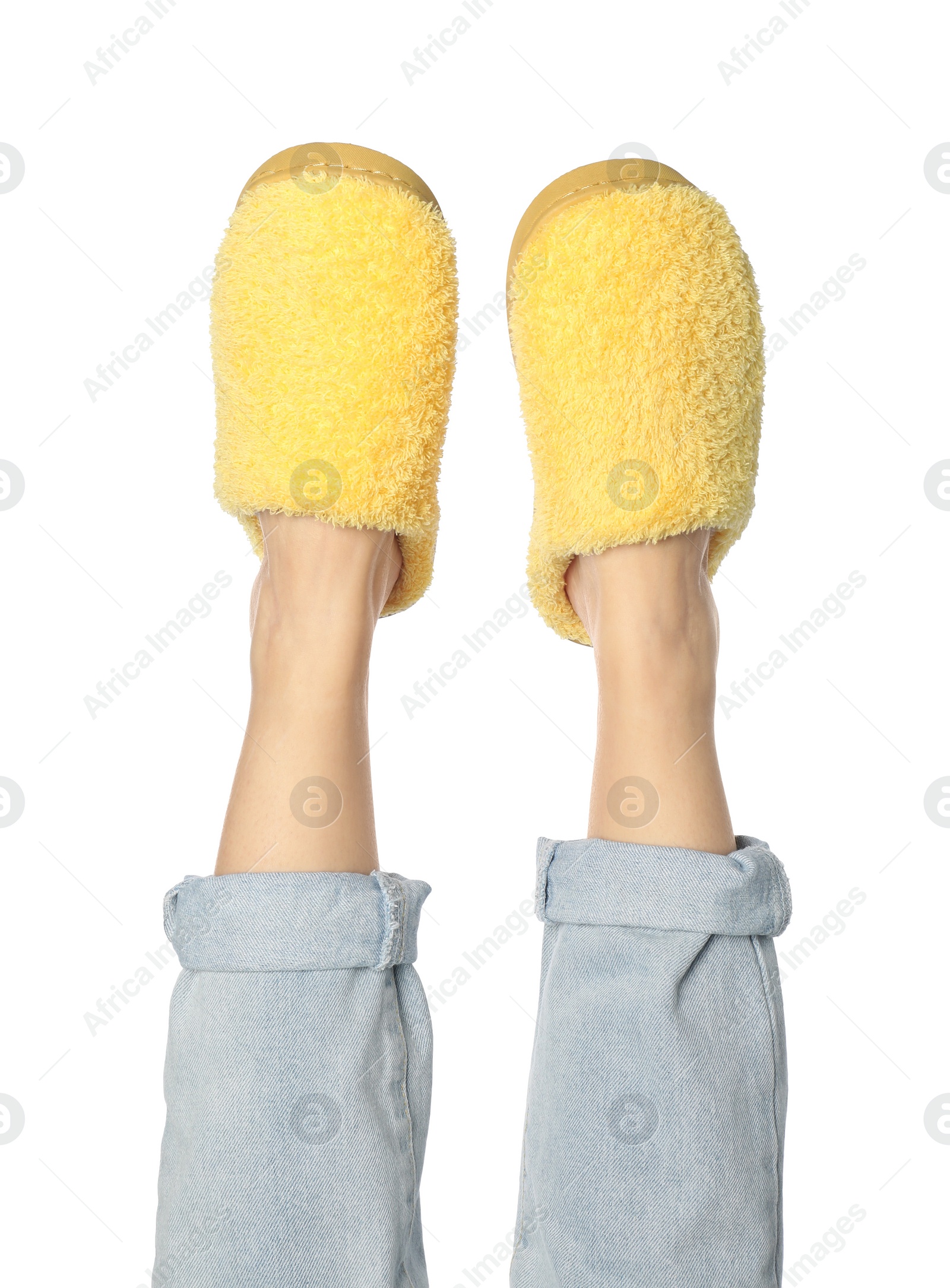 Photo of Woman in yellow soft slippers on white background, closeup