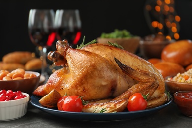 Photo of Traditional festive dinner with delicious roasted turkey served on table