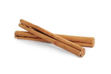 Aromatic dry cinnamon sticks on white background